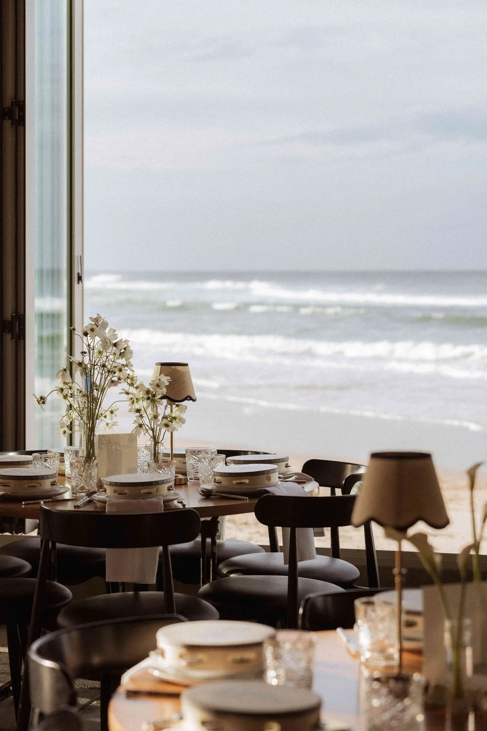 Tables overlooking the surf at Rick Shores